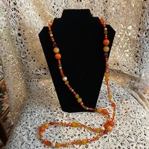 Vintage orange beaded long flapper necklace.